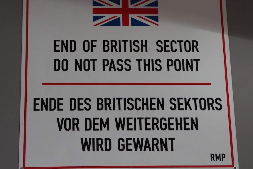 A sign with a warning written on it from the British sector of West Berlin