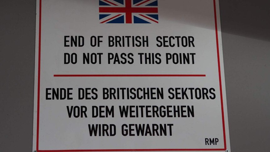 A sign with a warning written on it from the British sector of West Berlin