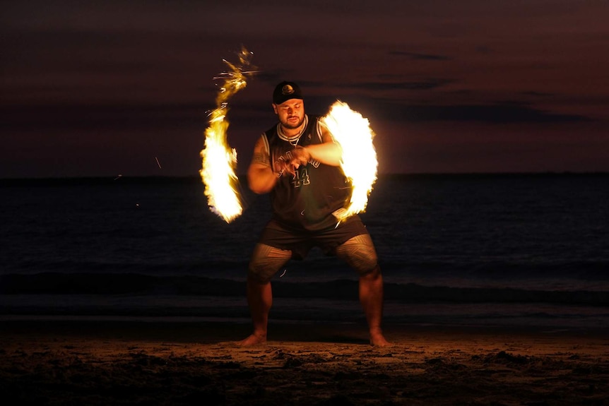 Fire spinner Hale Wilson spinning the Samoan fire knife.