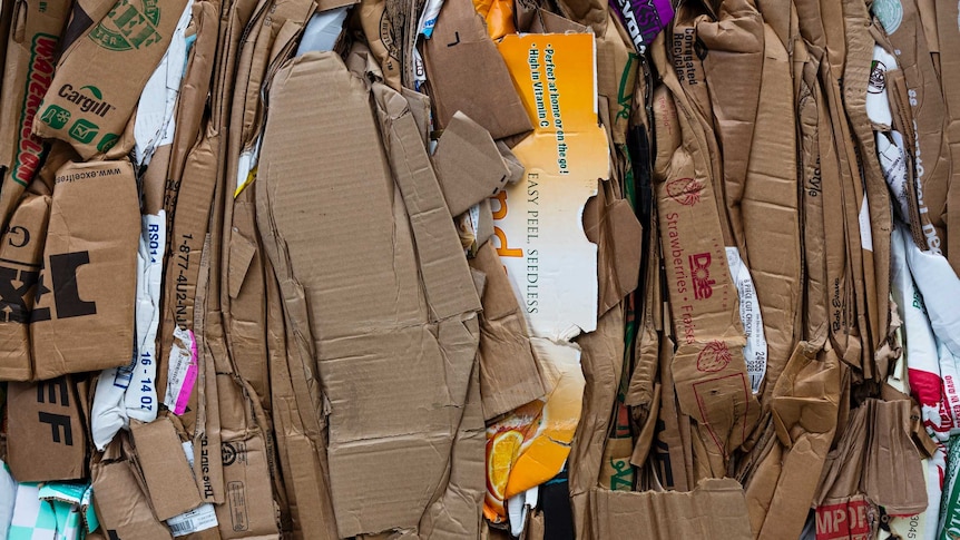 A pile of compacted cardboard boxes.