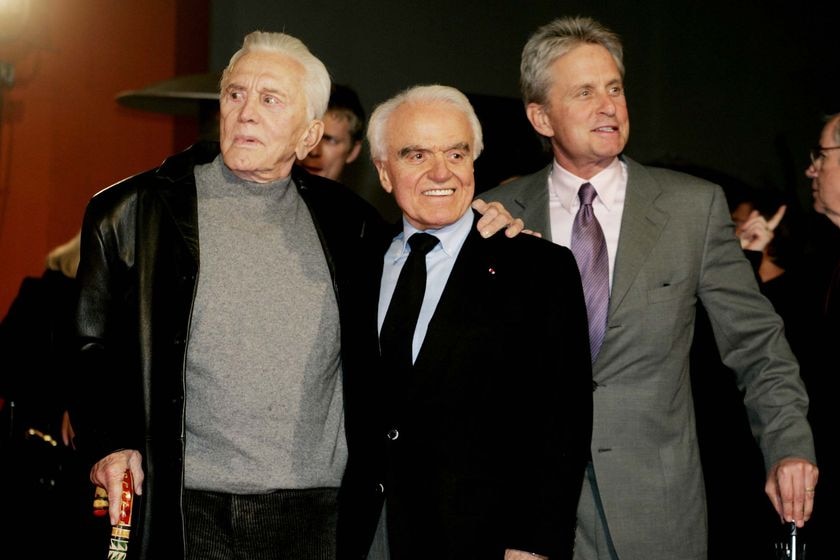 Jack Valenti poses with Kirk and Michael Douglas in Hollywood.