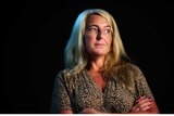 Nicola Gobbo gazing into the distance with her arms folded