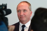 Barnaby Joyce wears a neutral expression with his mouth softly closed.