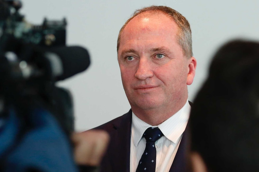 Barnaby Joyce wears a neutral expression with his mouth softly closed.