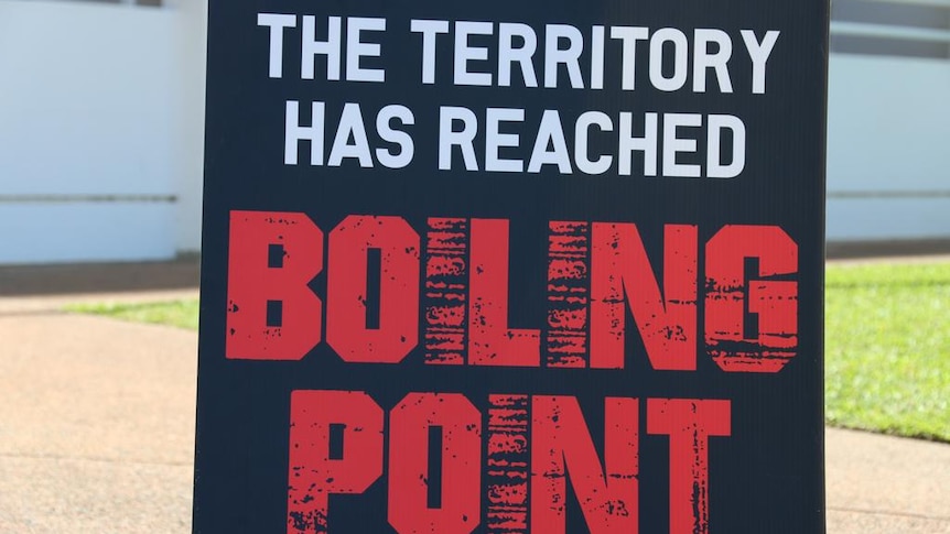 Black sign with white and red writing, with the big writing saying "boiling point"