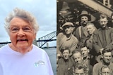 an elderly woman wearing glasses looking and a group of workers