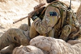Australian soldier waits for a compound clearance in Afghanistan.