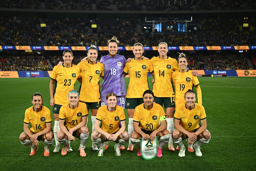 Matildas players pose for a team photo