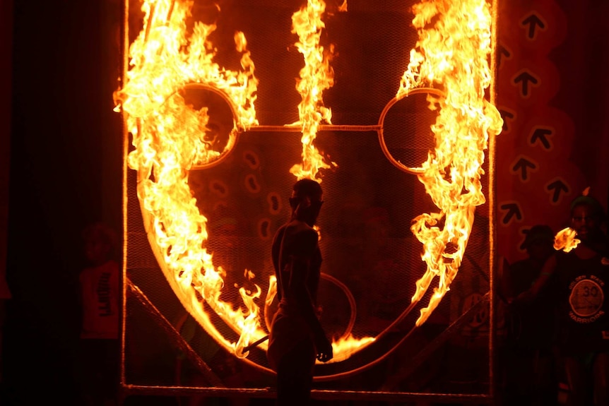 Performer lit a fire symbol, that represented the law, ceremony language and family at the end of Warlpiri performance.