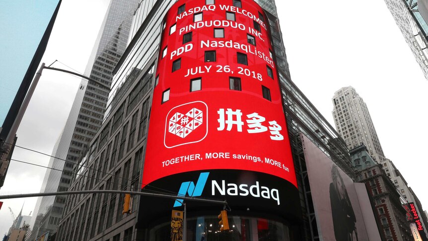 display at the Nasdaq Market Site shows a message after Chinese online group discounter Pinduoduo was listed.