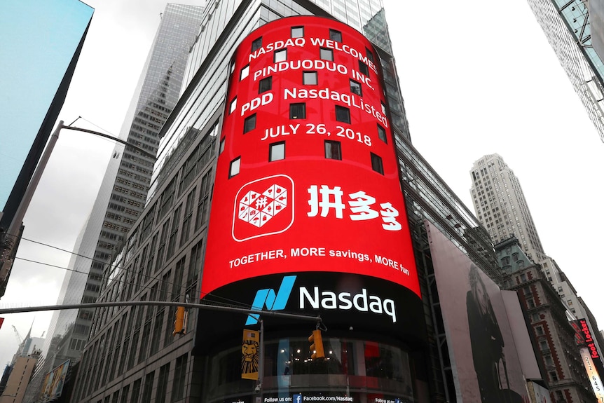 display at the Nasdaq Market Site shows a message after Chinese online group discounter Pinduoduo was listed.