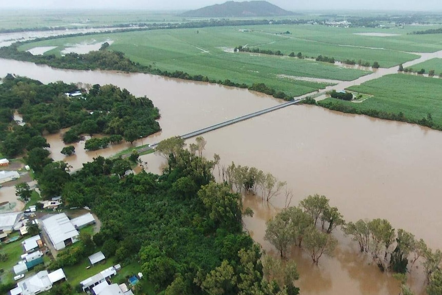 Aerial shot of flooded river cutting off rural town of Halifax