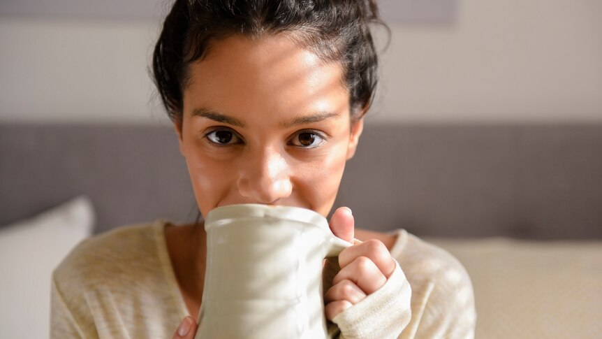 Woman holding morning cuppa