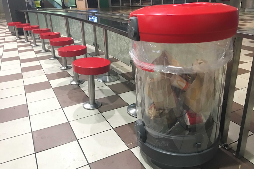 A clear rubbish bin installed at Brisbane's Central train station