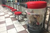 A clear rubbish bin installed at Brisbane's Central train station
