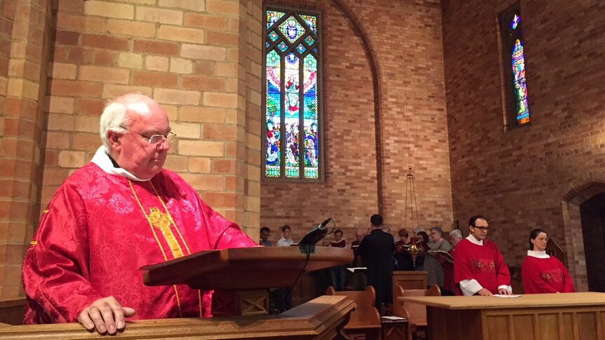Reverend Brain Douglas addresses those gathered for Good Friday service at St Paul's Anglican Church.