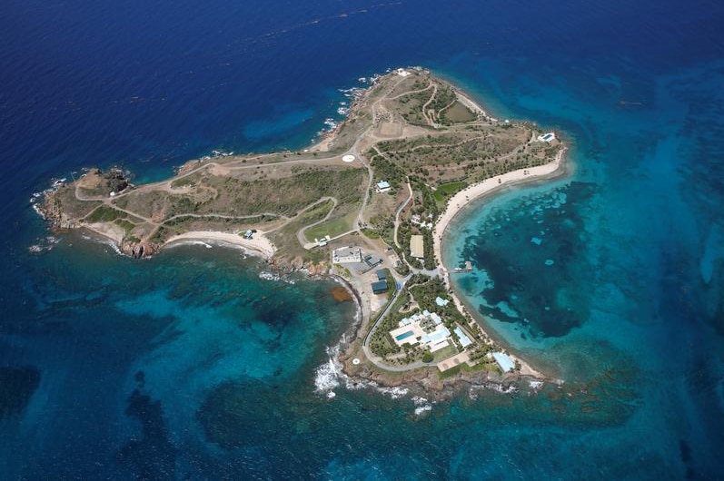 Little St James island from above, surrounded by the ocean.