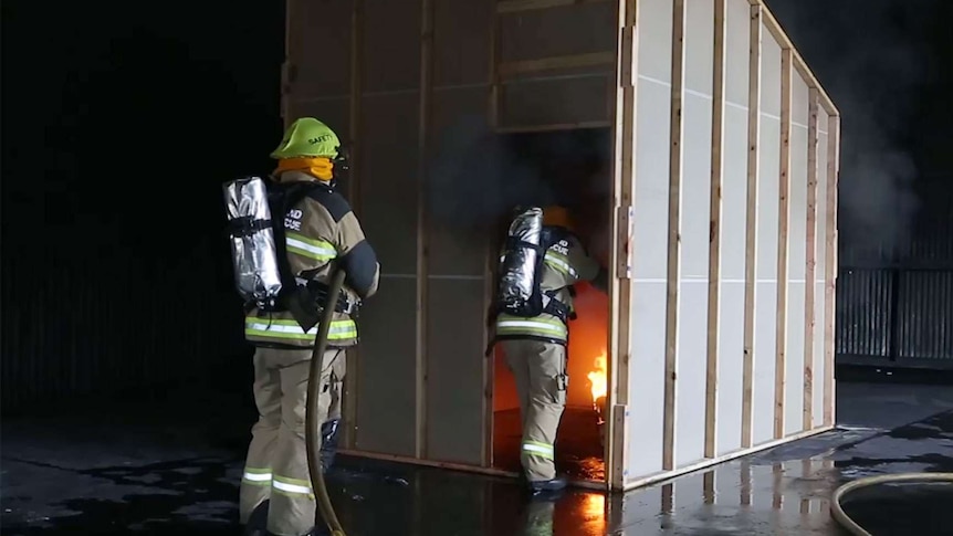 Queensland Fire and Rescue forensic investigators recreate a house fire as part of the investigation