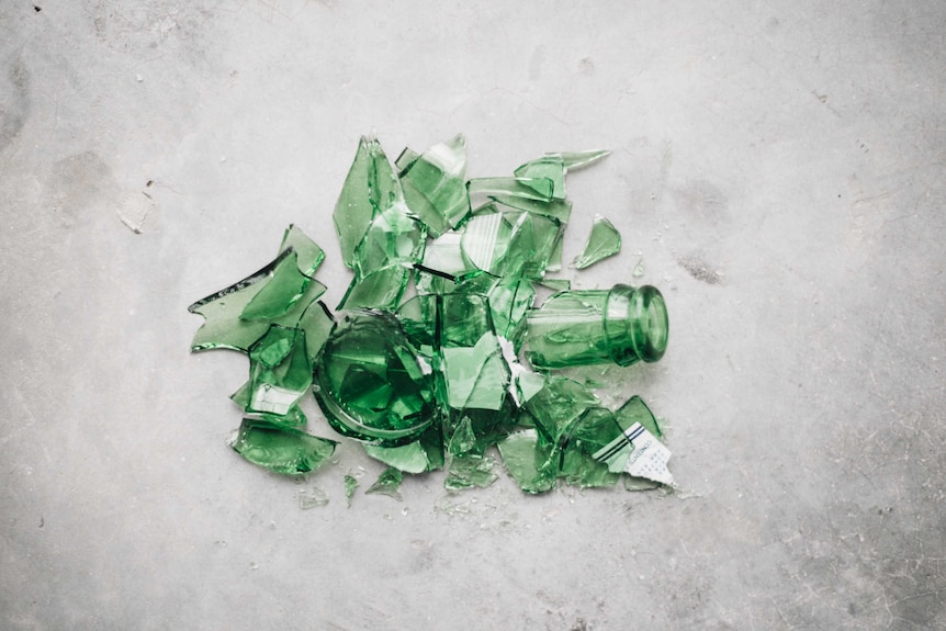 green broken glass bottle