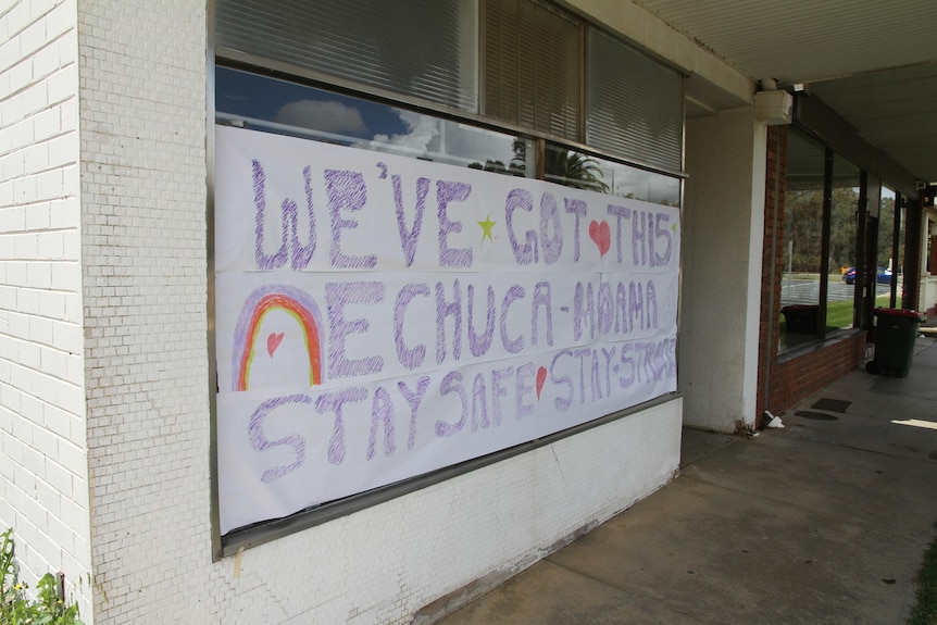 A white sign with purple text which reads, 'We've got this Echuca-Moama stay safe! Stay strong!'