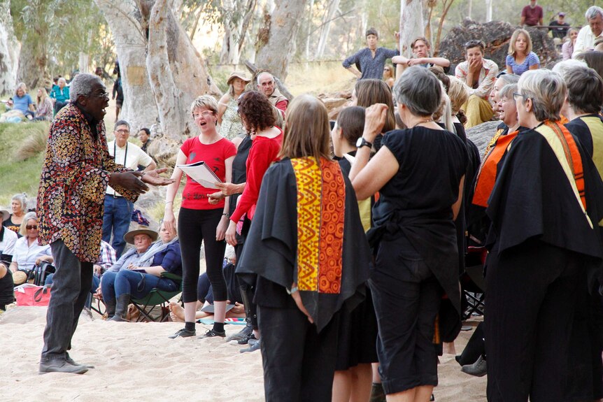 The Poco Tutti choir from Adelaide sings for a crowd at the end of the Desert Song Festival.
