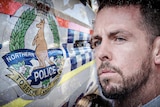 A digitally-altered picture of the NT Police logo next to Constable Zachary Rolfe's head