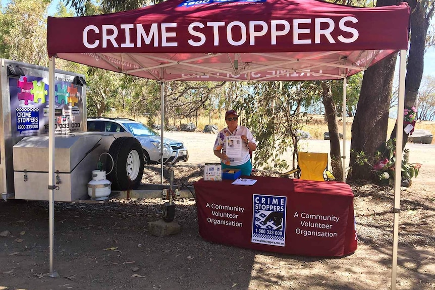 A Crimestoppers stall near the beachfront crime scene