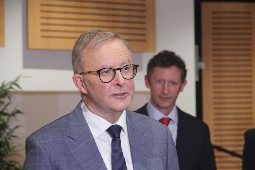 Man talking wearing a suit