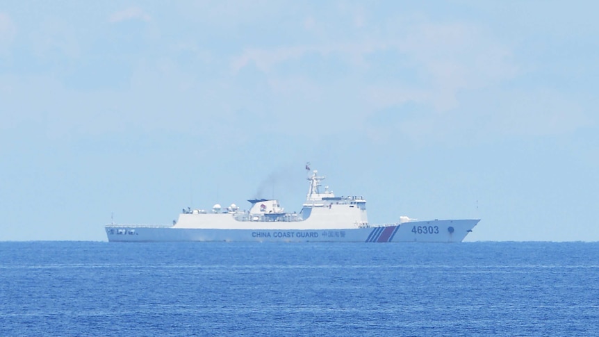 A Chinese coastguard ship is photographed far out at sea near Scarborough shoal in the South China Sea.