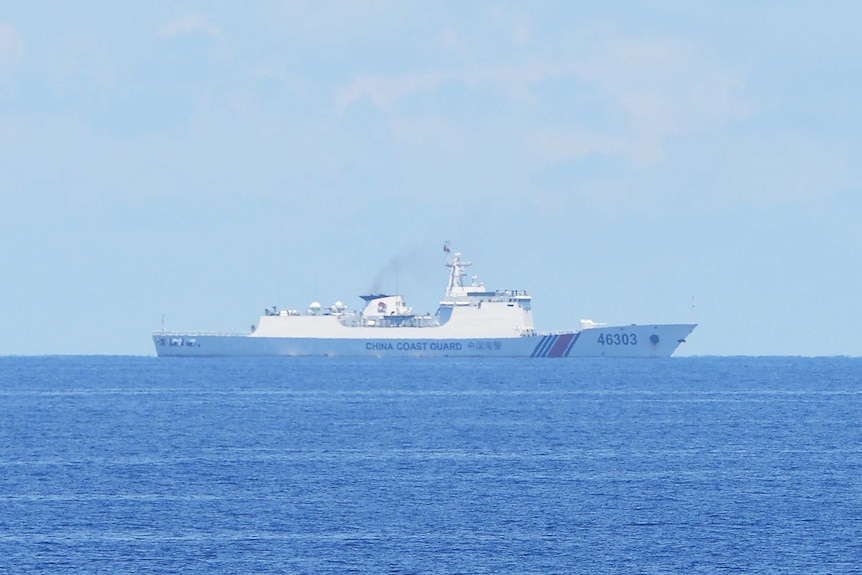A Chinese coastguard ship is photographed far out at sea near Scarborough shoal in the South China Sea.