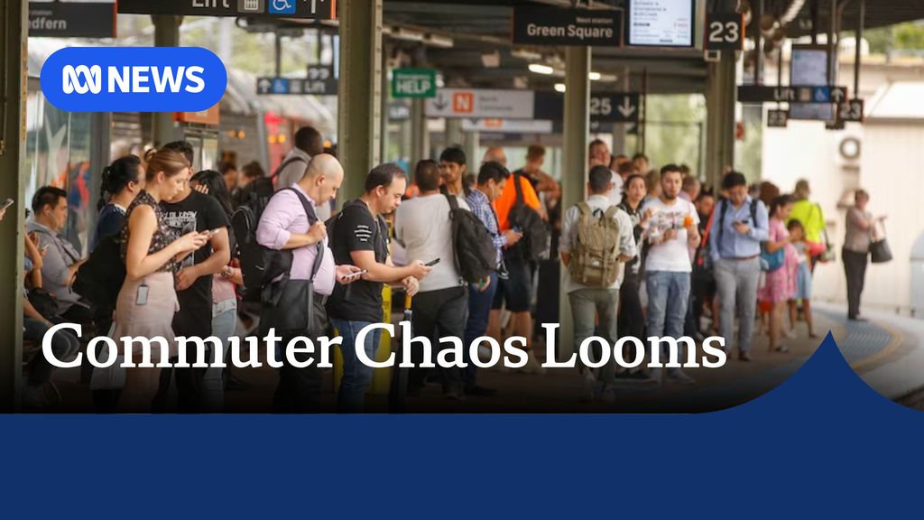 Commuter Chaos Looms: Commuters waiting on a train platform.