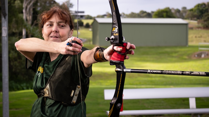 A woman with an archery bow