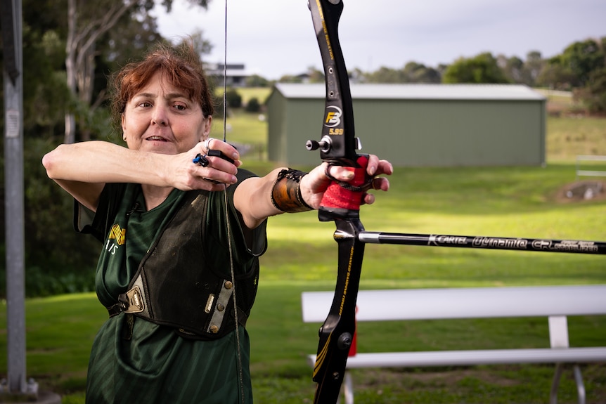 A woman with an archery bow