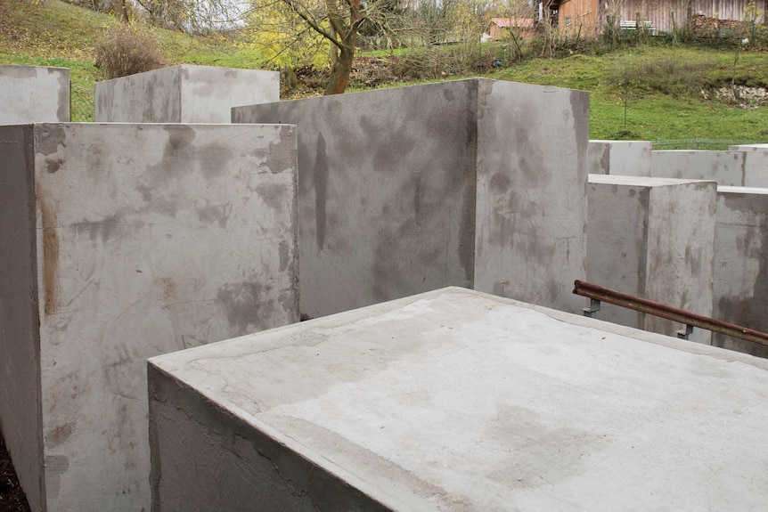Concrete blocks are placed on a property adjacent to Bjorn Hoecke's home