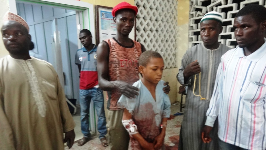 A young boy injured in the twin suicide blast at Kano central mosque arrives at the accident and emergency ward of the Nassarawa Specialist Hospital on November 28, 2014