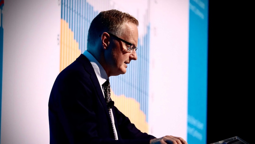 Reserve Bank governor Philip Lowe speaks at a podium