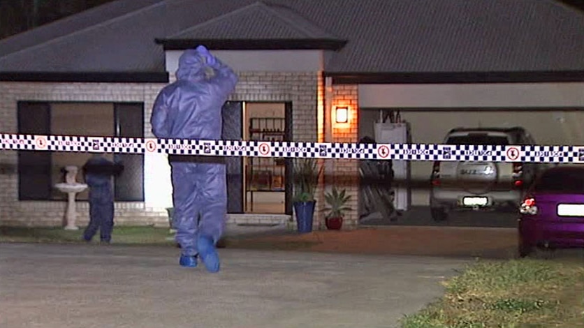 Police at house where a 23-year-old woman was stabbed to death at Logan, south of Brisbane, on February 16, 2014