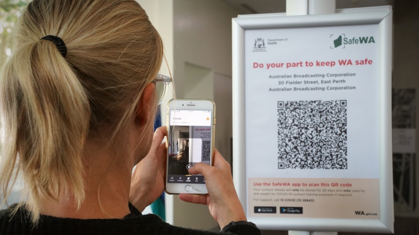 A person checks in to a venue using a QR code on a mobile phone