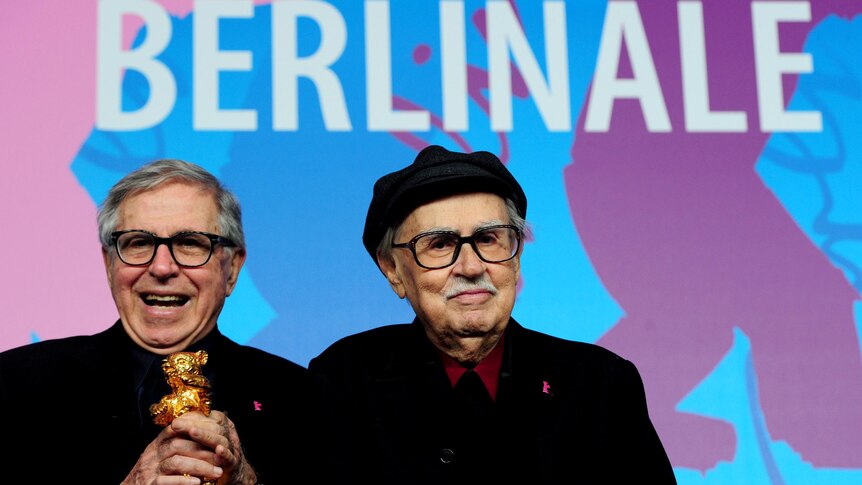 Paolo and Vittorio Taviani celebrate after receiving the Golden Bear award.