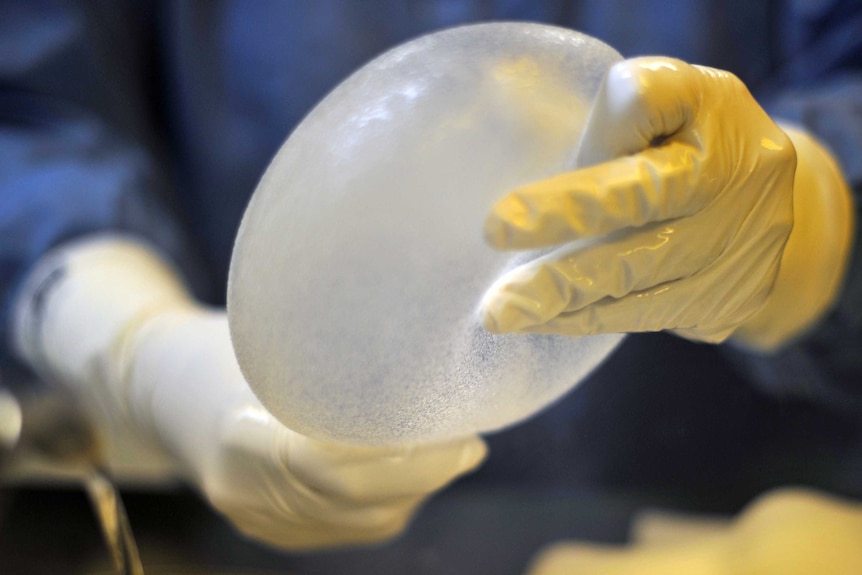 A technician works on a breast prosthesis at Silimed