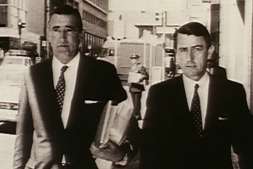 Historical photo of Neville Wran walking down the street