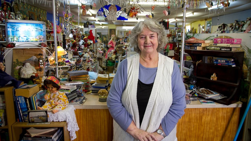 Norseman resident Sheila Tiefenbacher stands among her collection of china dolls and collectables.