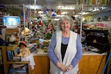 Norseman resident Sheila Tiefenbacher stands among her collection of china dolls and collectables.