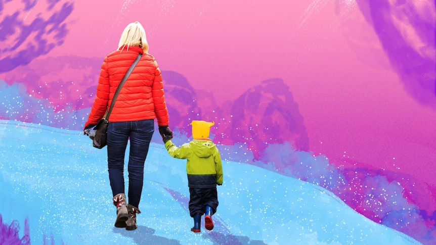 A woman in a red jacket holds the hand of a small child in a green jacket with a yellow beanie on as they walk away