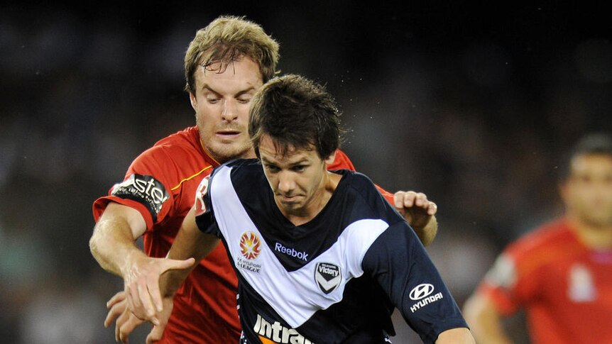Goal scorer Robbie Kruse controls the ball ahead of Adelaide's Iain Fyfe.