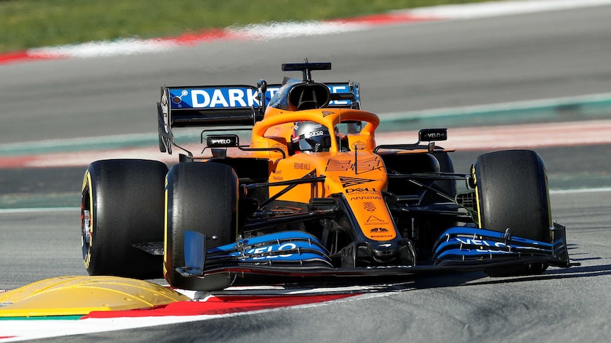 A McLaren Formula One car takes a turn in pre-season testing.