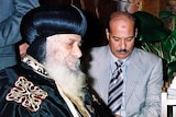 Coptic Pope Shenuda III (left)