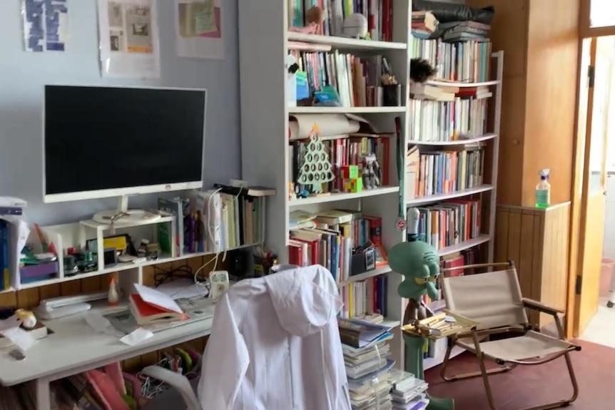 desk and bookshelves in a room