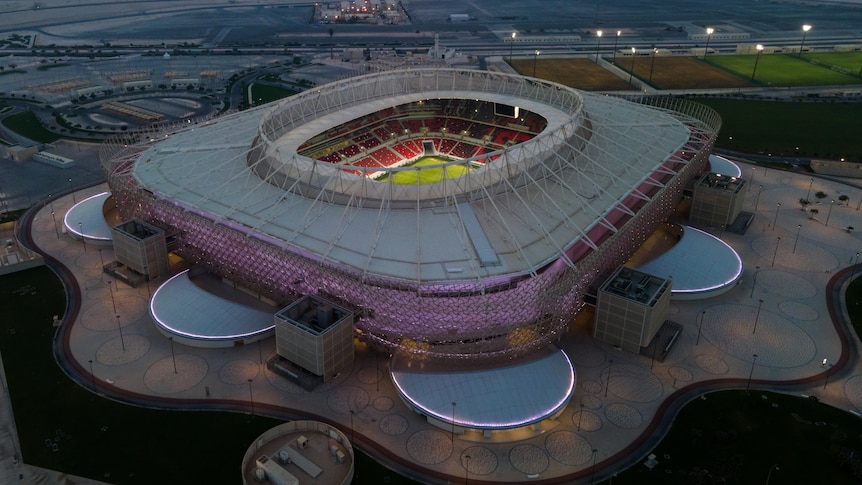 A soccer stadium lit up from the inside