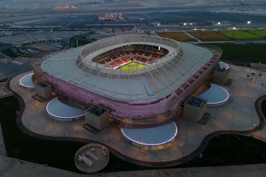 A soccer stadium lit up from the inside